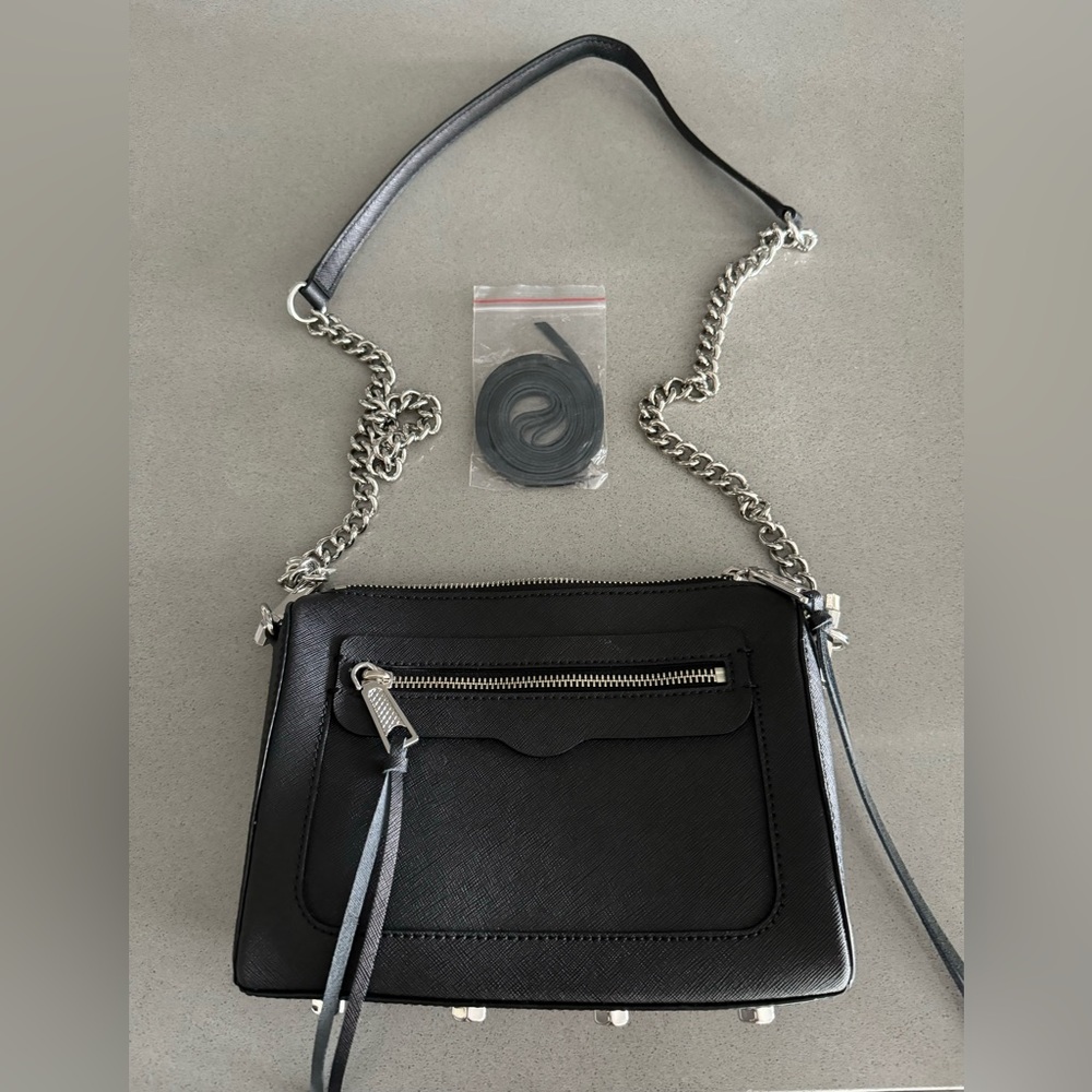 Can be worn multiple ways by adjusting strap. Includes new zipper straps